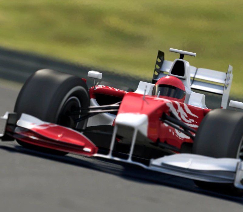 A red and white racing car on the track